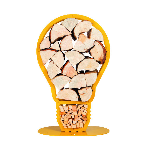 A front view of one of Ardour's light bulb shaped metal log baskets in honey yellow. It is a profile of a screw-in style light bulb attached to a base-plate. The design has two compartments; A small one at the top to store kindling and a large one for the main body of the bulb to store the logs.