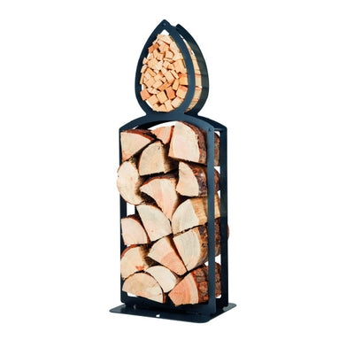 One of Ardour's candle shaped metal log baskets in jet black. This isometric view shows a tall candle she with two compartments; A small one in the shape of a flame at the top. this has kindling stored in it. A large opening represents the main body of the candle and stores the logs. Its compact design means logs can be stored in a smaller footprint than a traditional wicker basket
